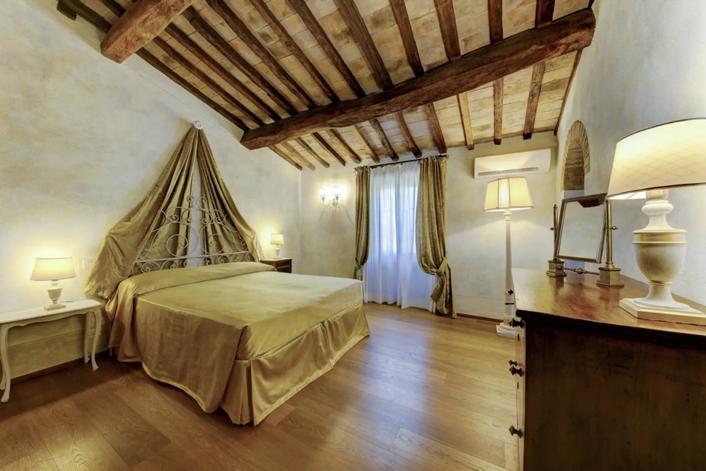 Bedroom with gold canopy